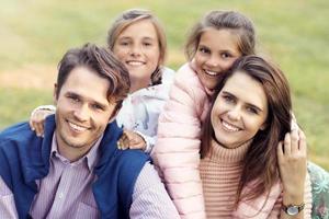 Young family with children having fun in nature photo