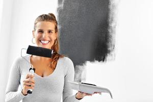 Mature woman doing home improvements photo