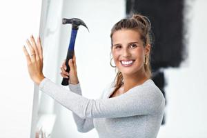 Mature woman doing home improvements photo