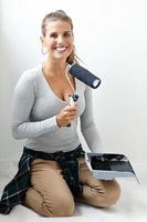 Mature woman doing home improvements photo