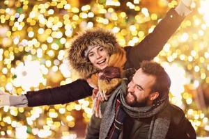 Adult couple hanging out in the city during Christmas time photo