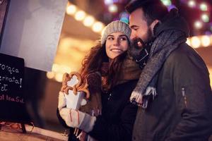 Adult couple hanging out in the city during Christmas time photo