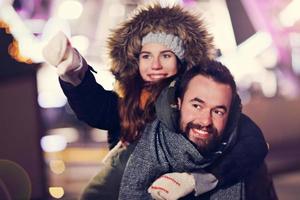 Couple having fun in the winter photo