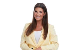 Beautiful woman in pastel suit posing over white background photo