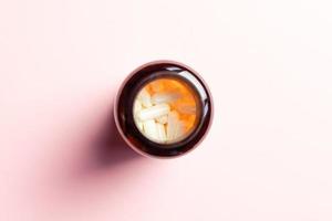Zinc capsules in a jar from above. photo