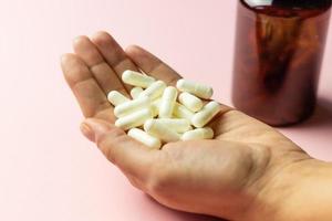 Zinc capsules held in the hand. photo