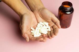 Zinc capsules held in the hand. photo