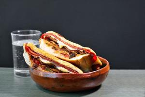 Mexican Torta Caprichosa Grande with Milanese pork, leg ham and cheese photo