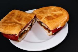 Mexican Torta Caprichosa Grande with Milanese pork, leg ham and cheese photo