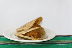 Mexican gorditas de migajas with pork rinds and chile photo