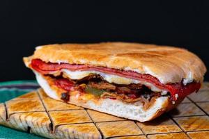 Mexican Torta Caprichosa Grande with Milanese pork, leg ham and cheese photo