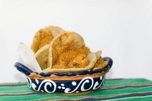 Mexican gorditas de migajas with pork rinds and chile photo