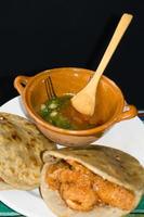 Mexican gorditas de migajas with pork rinds and chile photo