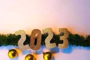 Happy New Year 2023. Golden numbers Christmas white background photo