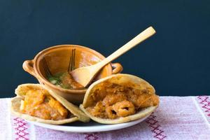 Mexican gorditas de migajas with pork rinds and chile photo