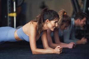 Group of people working out in a gym photo