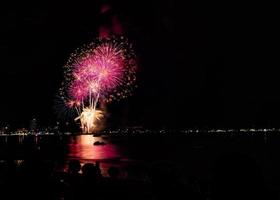 Abstract colored firework background light up the sky with dazzling display photo