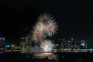 Abstract colored firework background light up the sky with dazzling display photo