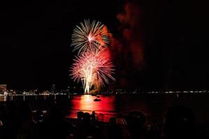 Abstract colored firework background light up the sky with dazzling display photo