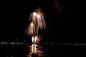 Abstract colored firework background light up the sky with dazzling display photo