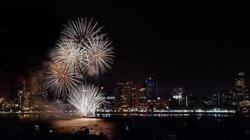 Abstract colored firework background light up the sky with dazzling display photo