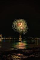 Abstract colored firework background light up the sky with dazzling display photo