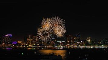 Abstract colored firework background light up the sky with dazzling display photo