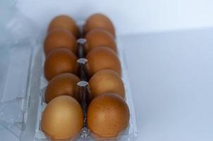 Eggs in box. Natural healthy food and organic farming concept. Fresh chicken eggs background. photo