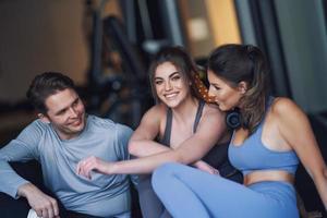 Group of people working out in a gym photo