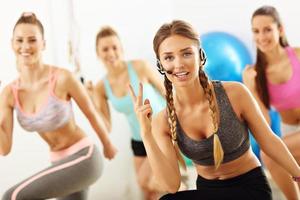 Group of smiling people doing aerobics photo