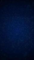 Abstract background dark blue with motion particles. Vertical looped video