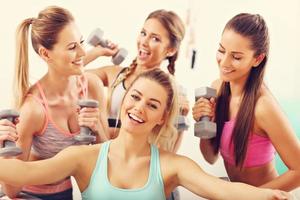 Young women group taking selfie at the gym after workout photo