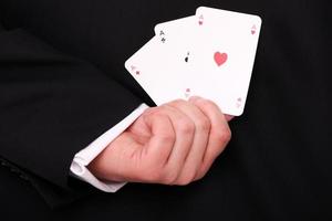 Man on suit with playing cards photo