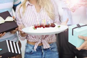 Group of friends having fun at birthday party photo