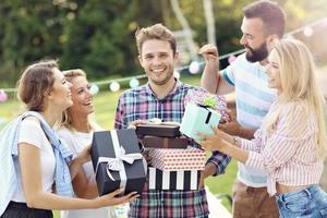 Group of friends having fun at birthday party photo