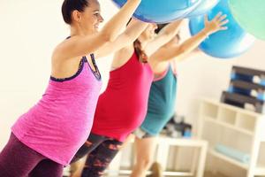 Group of pregnant women during fitness class photo