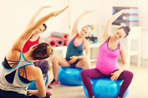 Group of pregnant women during fitness class photo