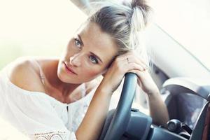 Transportation concept - tired woman driver photo