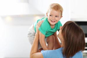 Portrait of Mother with happy son at home photo