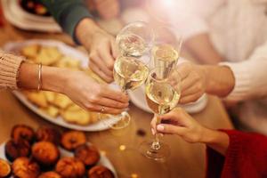 Group of friends celebrating Christmas at home photo