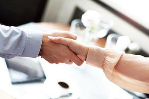 Two Businesspeople Meeting For Lunch In Restaurant photo