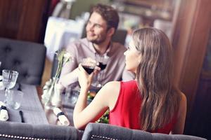 Romantic couple dating in restaurant photo