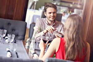 Romantic couple dating in restaurant photo