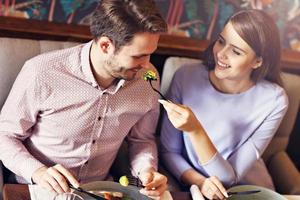 Romantic couple dating in restaurant photo