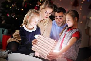 Happy Family Opening Christmas Present photo