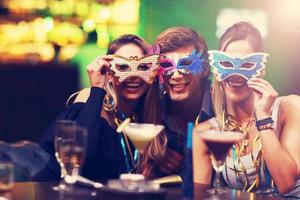 Group Of Friends Enjoying Drink in Bar photo