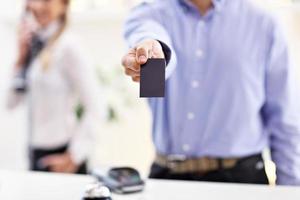 Happy receptionist working in hotel photo