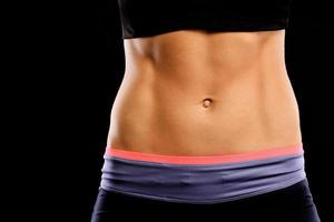 Muscular female abdomen photo