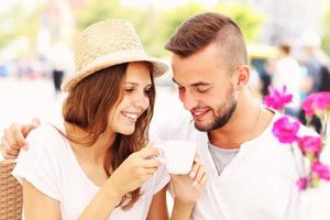 Happy couple drinking coffee photo