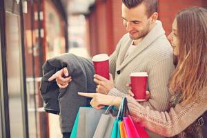 Happy couple shopping in the city photo